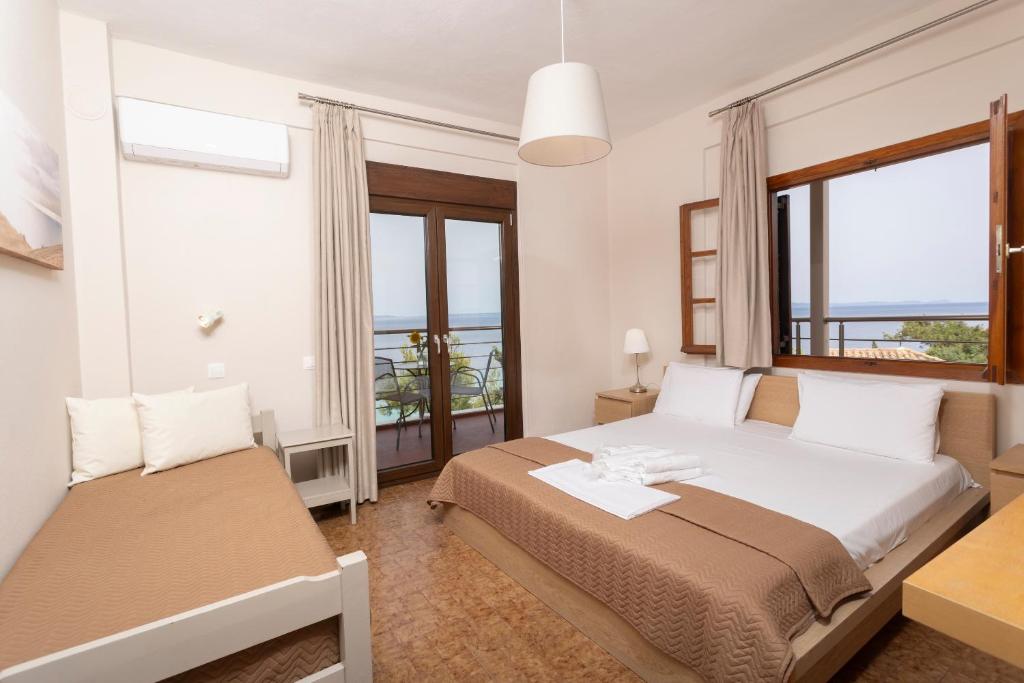Postel nebo postele na pokoji v ubytování Sea View Apollo Apartments & Studios in Afytos