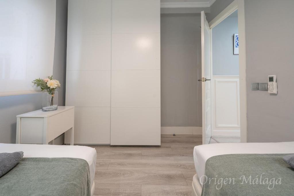 Posteľ alebo postele v izbe v ubytovaní Xpce Malaga SOHO