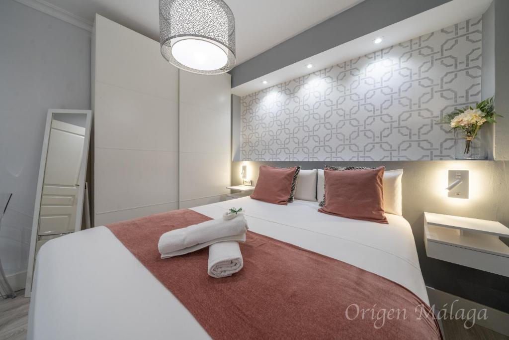 Posteľ alebo postele v izbe v ubytovaní Xpce Malaga SOHO