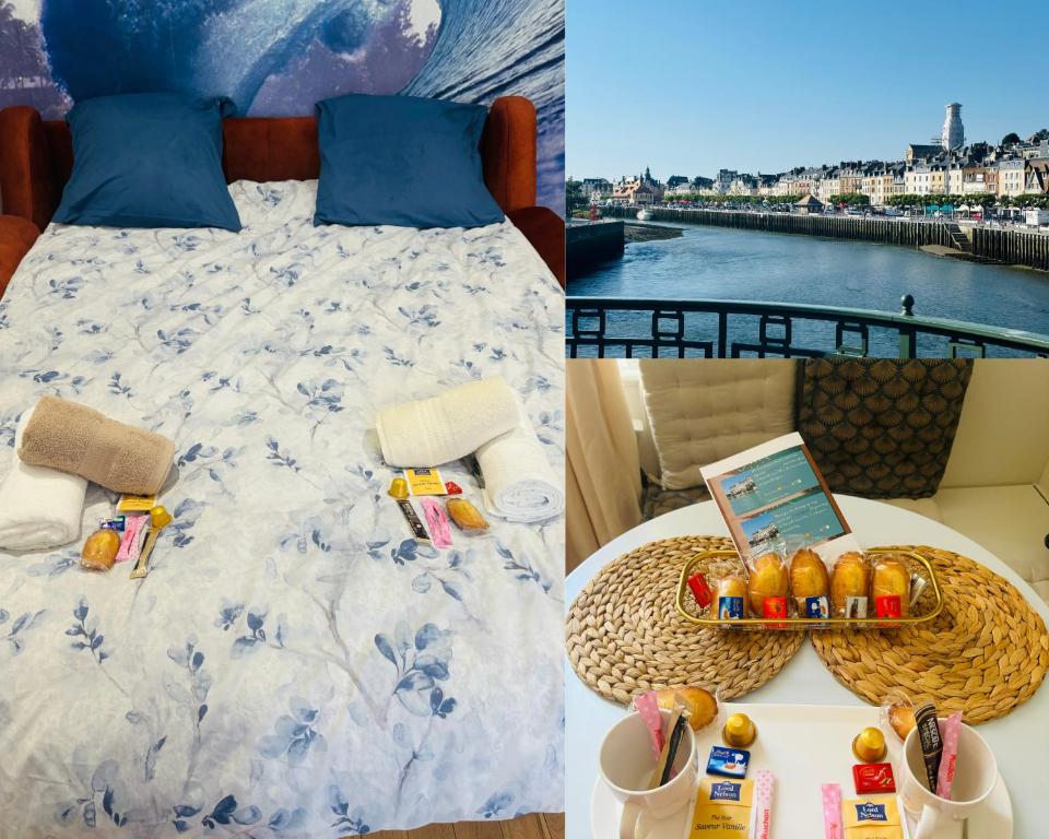 a bed and a table with a tray of food on it at Cosy Appart - Plage à 2min - Casino à 1min in Trouville-sur-Mer