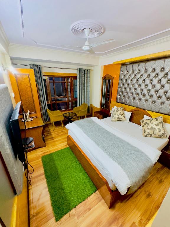 Postel nebo postele na pokoji v ubytování Hotel Apple Regency