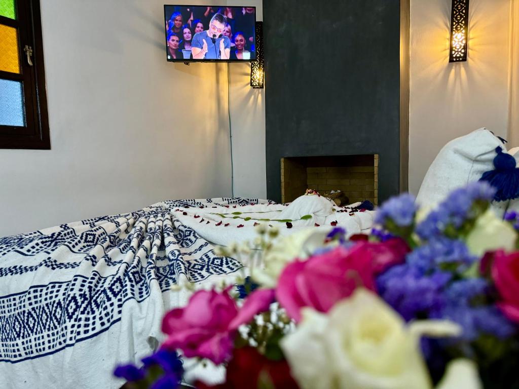 Postel nebo postele na pokoji v ubytování Riad Iklil