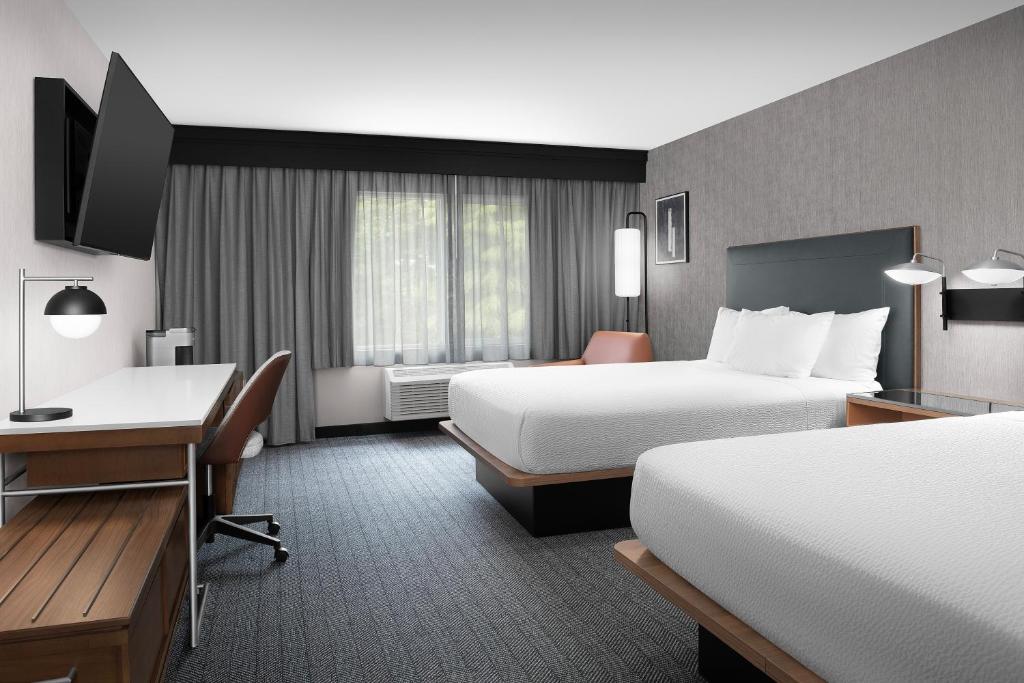 Postel nebo postele na pokoji v ubytování Courtyard by Marriott Portland Tigard