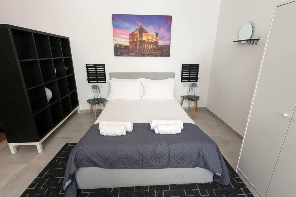 Postel nebo postele na pokoji v ubytování Casa Cospicua