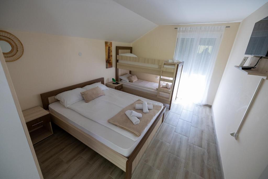 Ένα ή περισσότερα κρεβάτια σε δωμάτιο στο Vila Zen