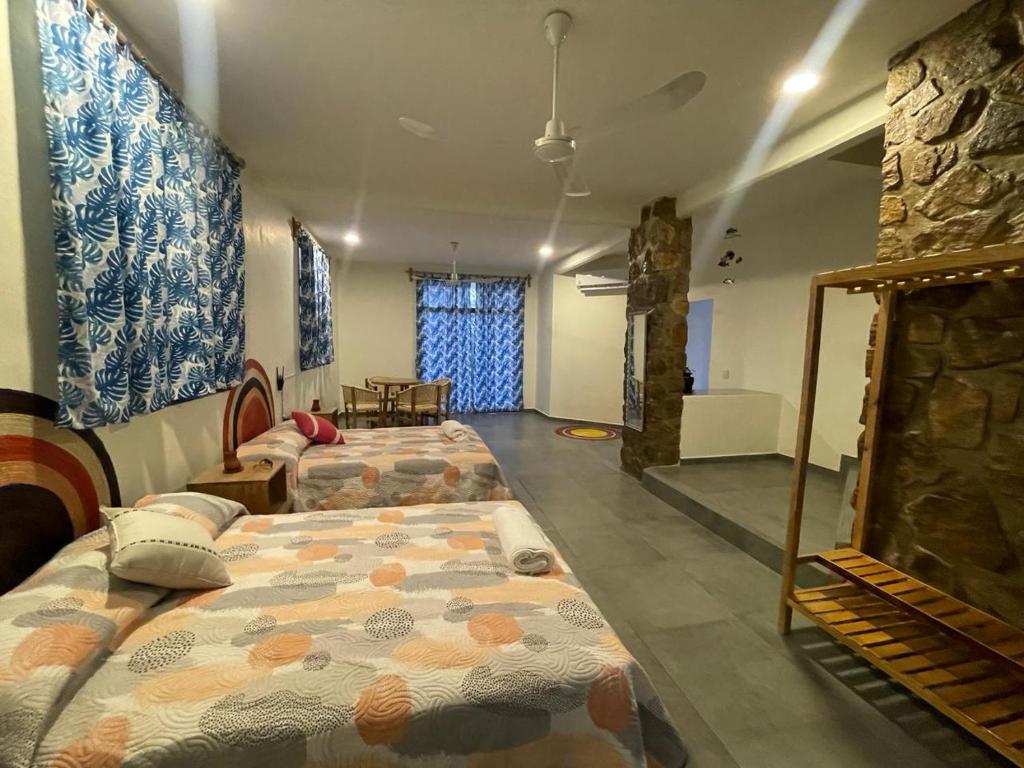 Ένα ή περισσότερα κρεβάτια σε δωμάτιο στο Casa Colibrí