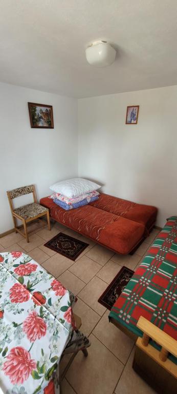 Postel nebo postele na pokoji v ubytování Dom Bursztynek - domek murowany