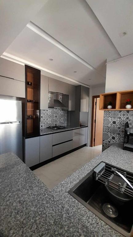 Kuchyň nebo kuchyňský kout v ubytování Appartement Kelibia