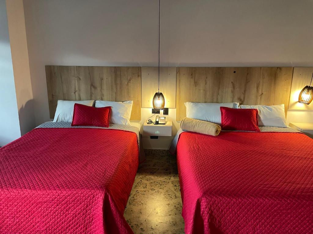 Postel nebo postele na pokoji v ubytování Hotel Ofix