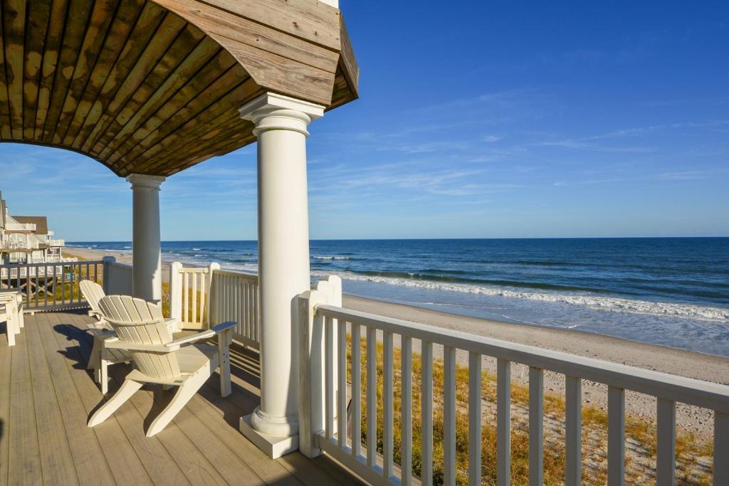 a porch with a gazebo with a view of the beach at My Blue Haven in North Topsail Beach