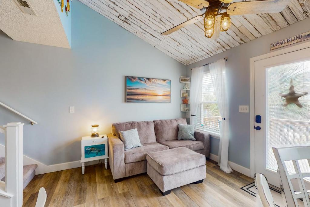 a living room with a couch and a chair at Bermuda Place in North Topsail Beach