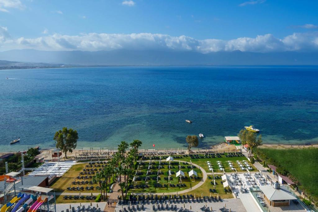 an aerial view of a park and the ocean at Liberty Kuşadası in Kusadası