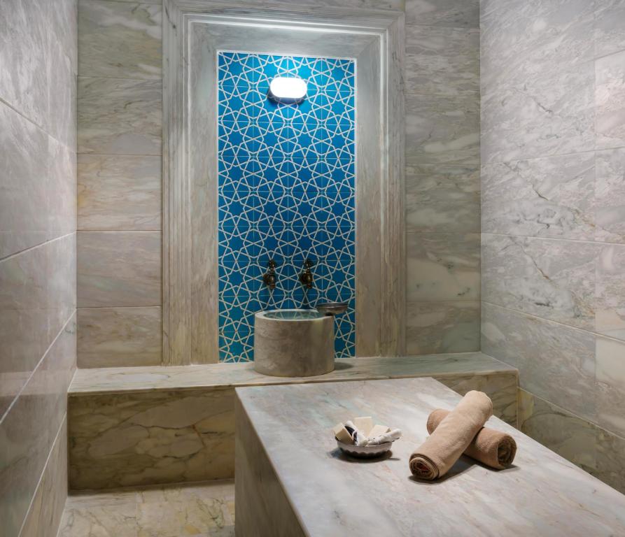 a bathroom with a shower with a sink in it at Liberty Kuşadası in Kusadası