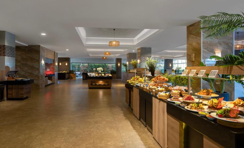 a buffet line with many different types of food at Liberty Kuşadası in Kusadası