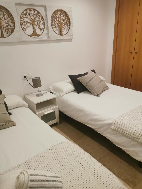 Postel nebo postele na pokoji v ubytování Manilva House