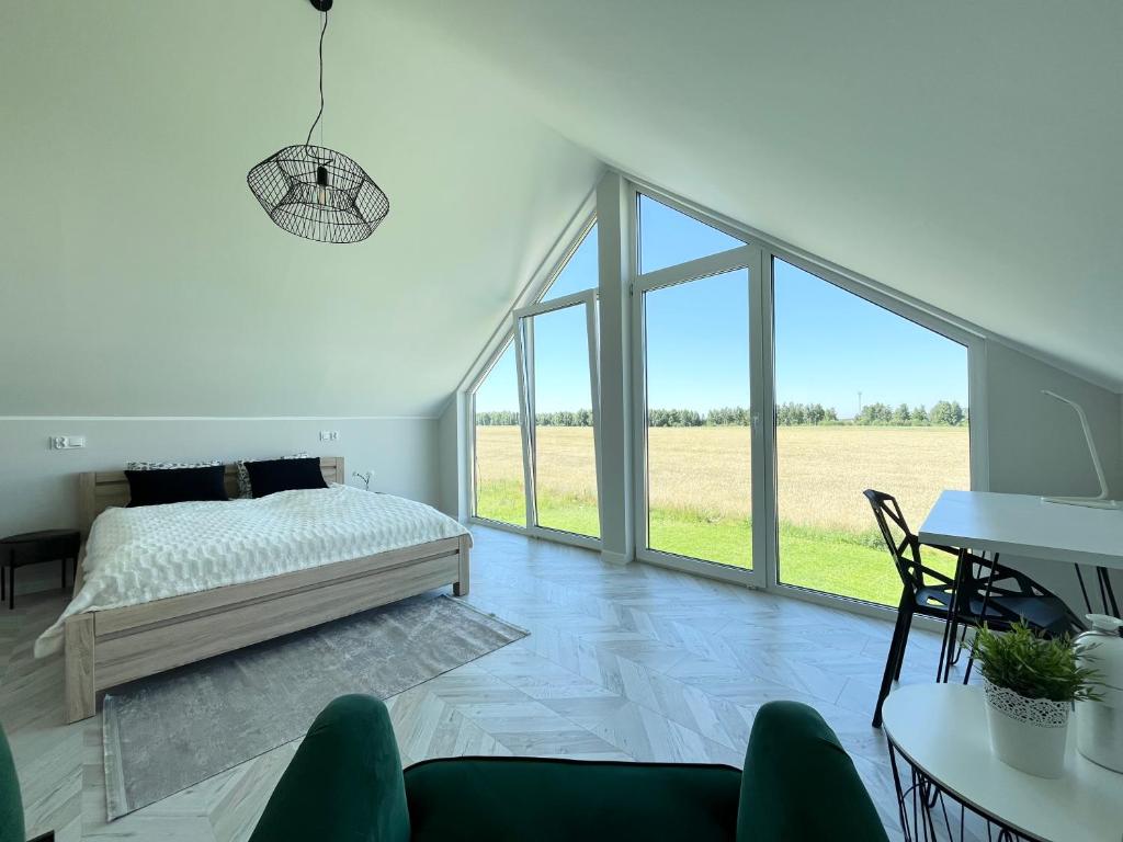 Postel nebo postele na pokoji v ubytování Tu jest pięknie- dom premium z ogrodowym spa