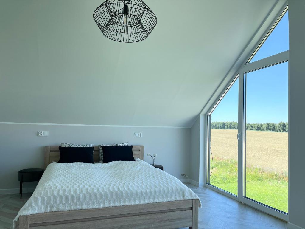 Postel nebo postele na pokoji v ubytování Tu jest pięknie- dom premium z ogrodowym spa