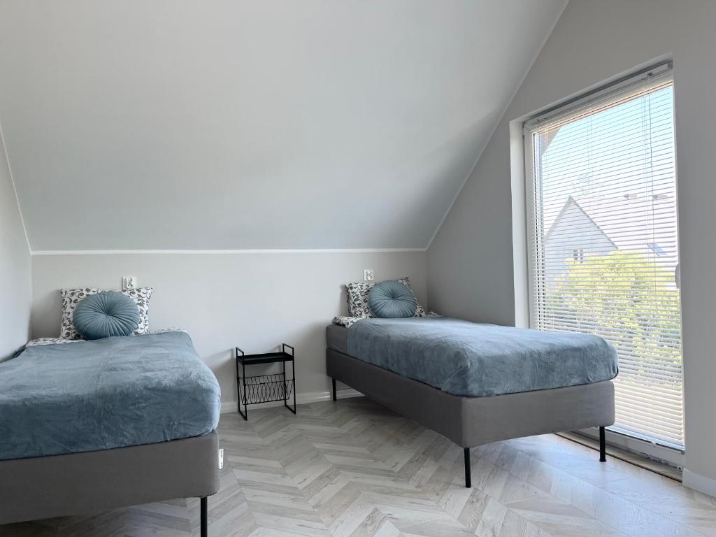 Postel nebo postele na pokoji v ubytování Tu jest pięknie- dom premium z ogrodowym spa
