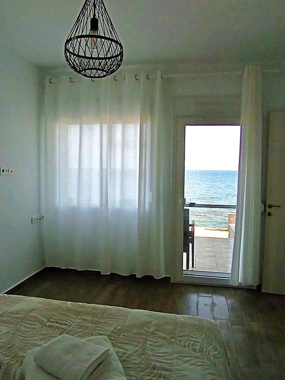 Posteľ alebo postele v izbe v ubytovaní Villa Dimitri - Beach House