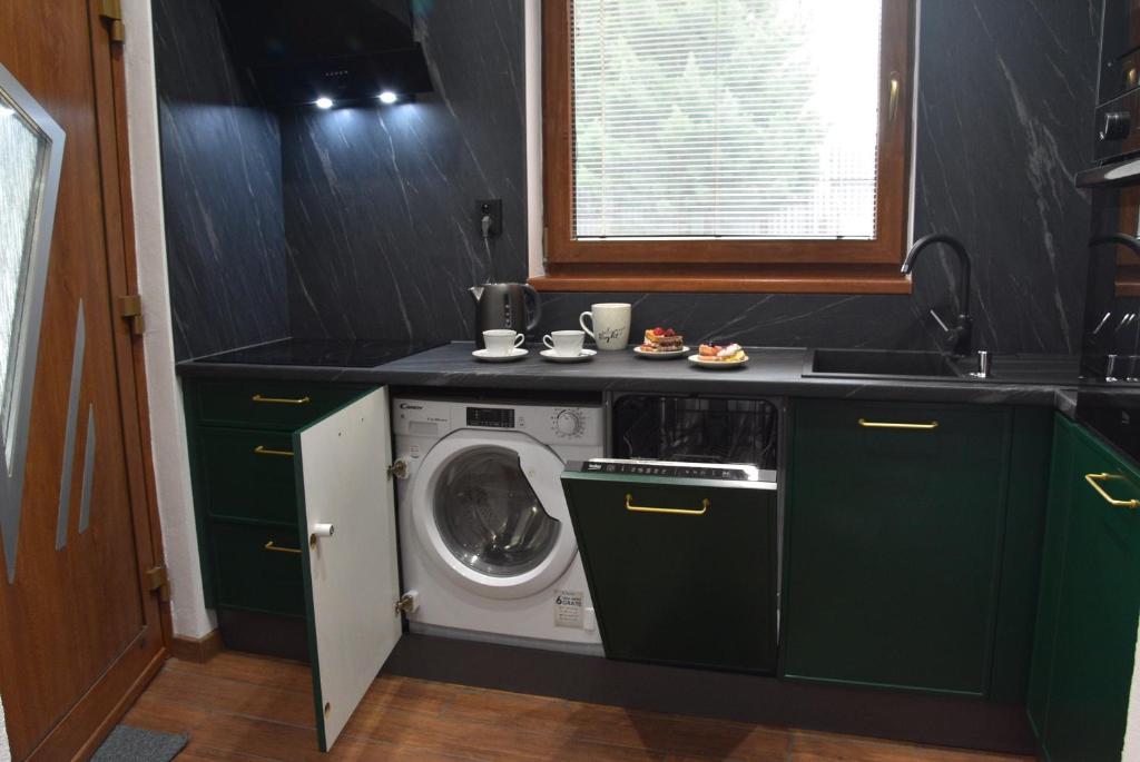 Kuchyň nebo kuchyňský kout v ubytování Apartmány Žakovce & SPA