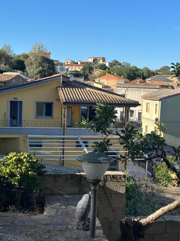 a house with a bird bath in a yard at Sole&Luna in Armungia