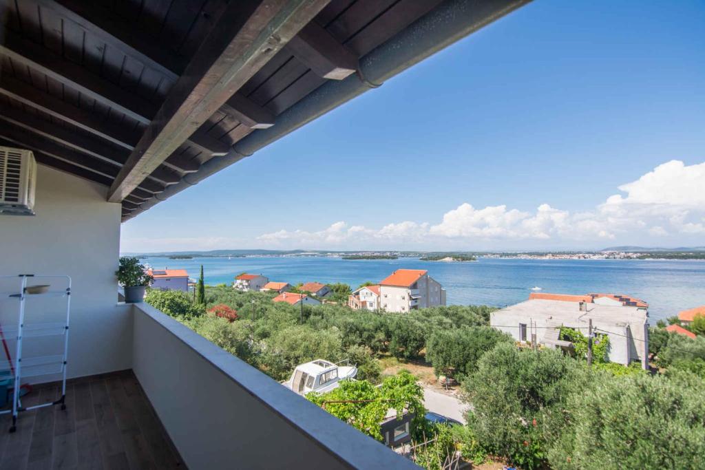 a balcony with a view of the water at Apartment in Tkon - Insel Pasman 50975 in Tkon