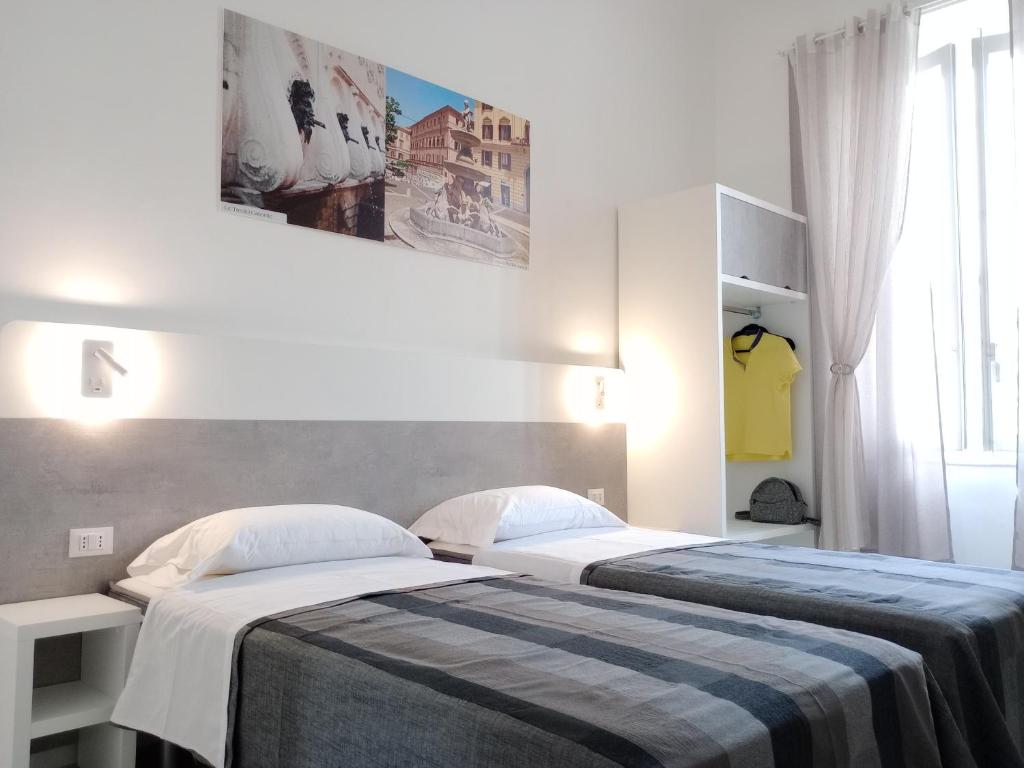 Postel nebo postele na pokoji v ubytování La Piazza