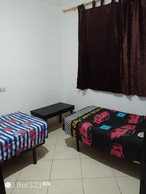Postel nebo postele na pokoji v ubytování Un joli appartement à Martil pour vos vacances d'été proche de toutes les commodités et à 5 min de la plage !