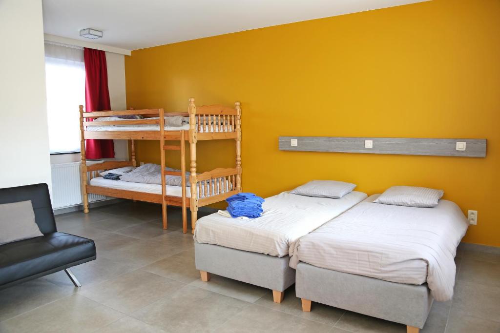 Postel nebo postele na pokoji v ubytování Logies Ternier