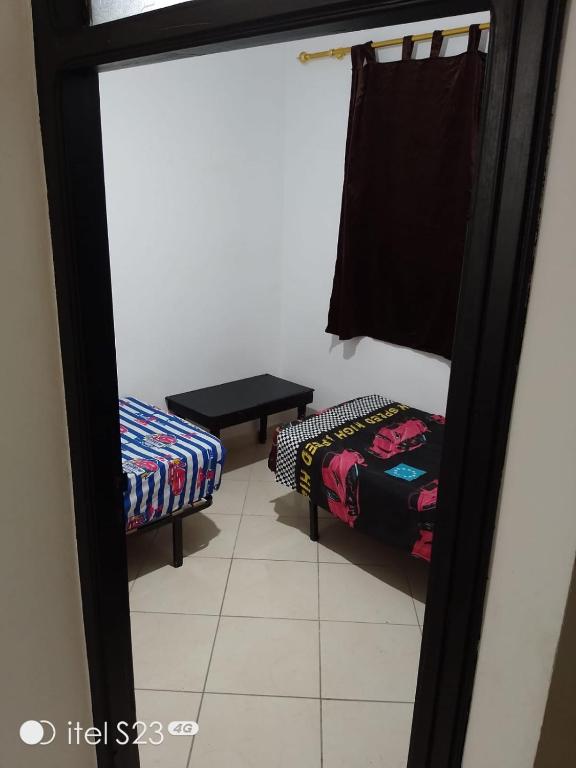 Postel nebo postele na pokoji v ubytování Un joli appartement à Martil pour vos vacances d'été proche de toutes les commodités et à 5 min de la plage !