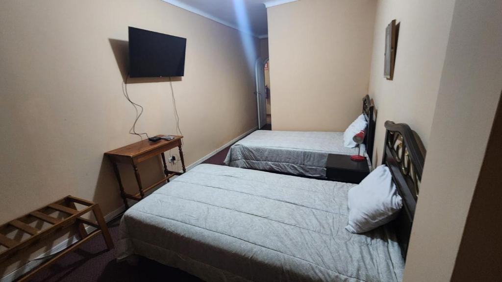 Postel nebo postele na pokoji v ubytování Posada Don Giorgio