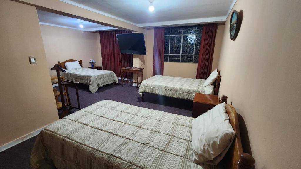 Postel nebo postele na pokoji v ubytování Posada Don Giorgio