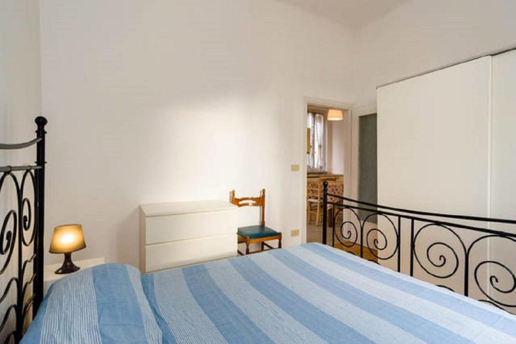 Łóżko lub łóżka w pokoju w obiekcie Varazze Apartment