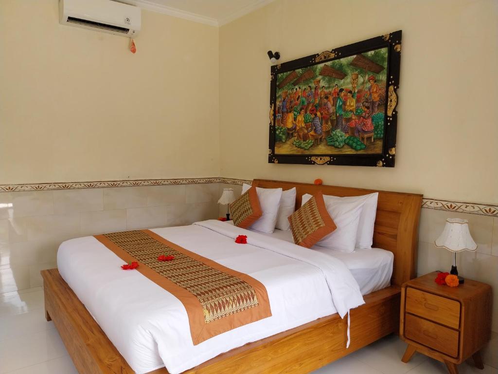 Postel nebo postele na pokoji v ubytování Puri Prana Guest House