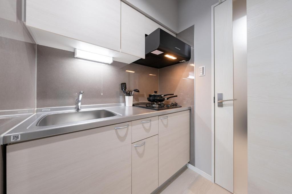 Kuchyň nebo kuchyňský kout v ubytování Provence Hotel
