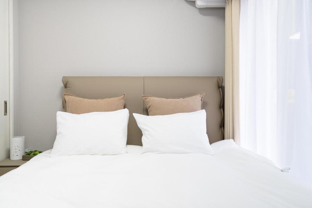 Postel nebo postele na pokoji v ubytování Provence Hotel