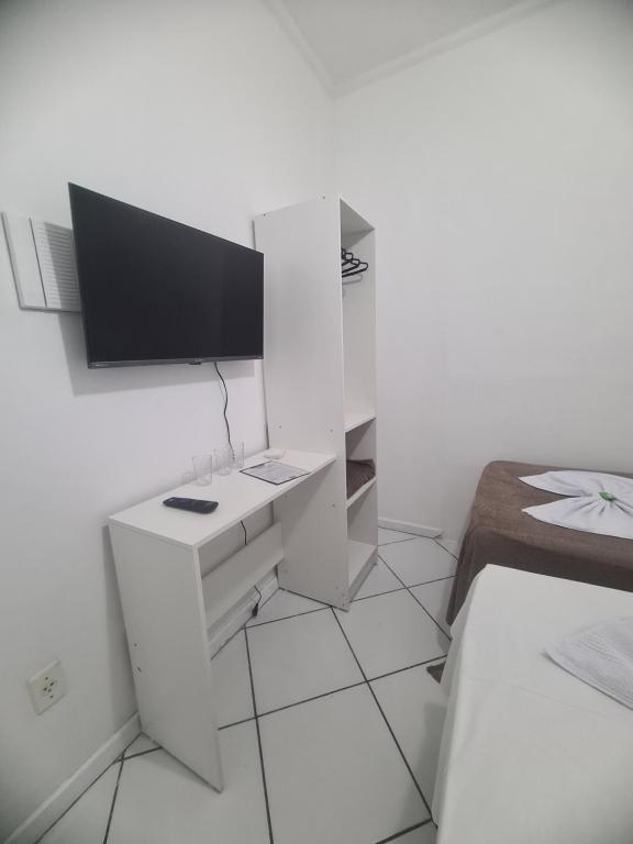 TV a/nebo společenská místnost v ubytování Hotel Aconchegante