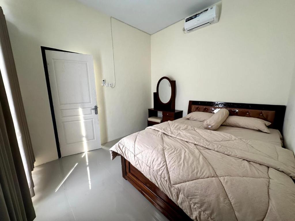 Postel nebo postele na pokoji v ubytování Villa Awwa