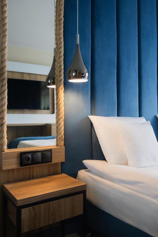 Postel nebo postele na pokoji v ubytování Porta Mare Active & Spa Resort