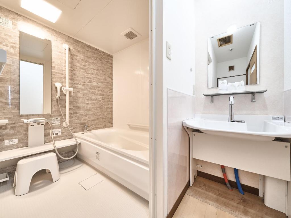 Koupelna v ubytování Okasan Hotel