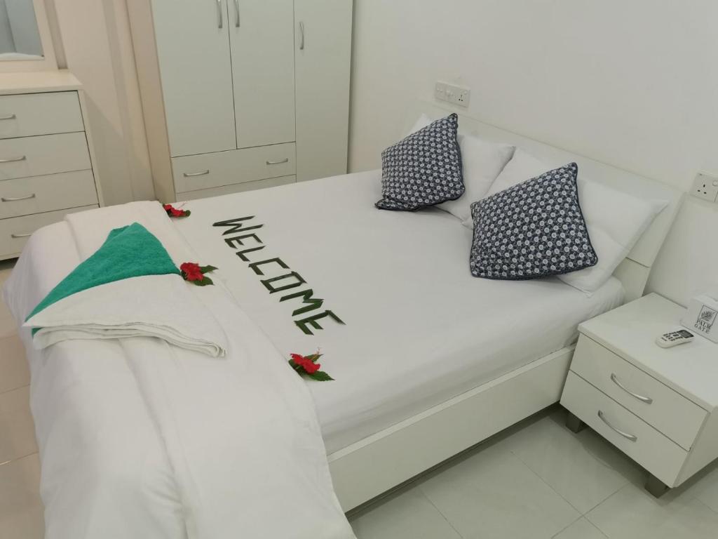 Postel nebo postele na pokoji v ubytování Palm Gate Maldives