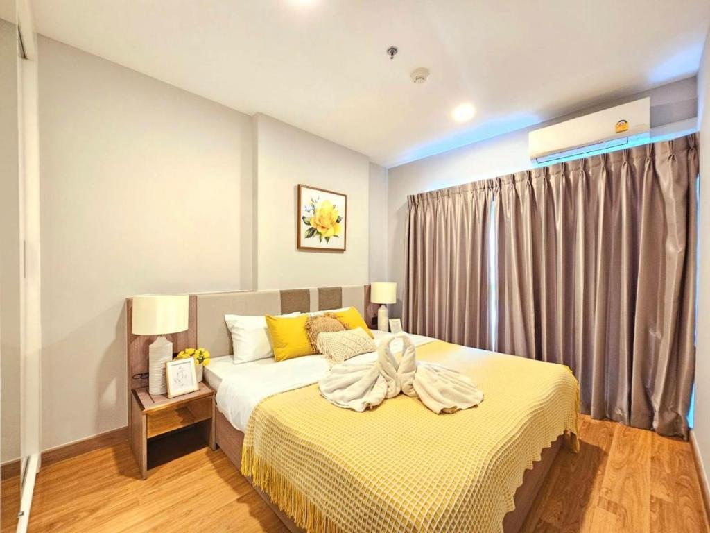 En eller flere senge i et værelse på Astra Sky River Chiang Mai by Fang