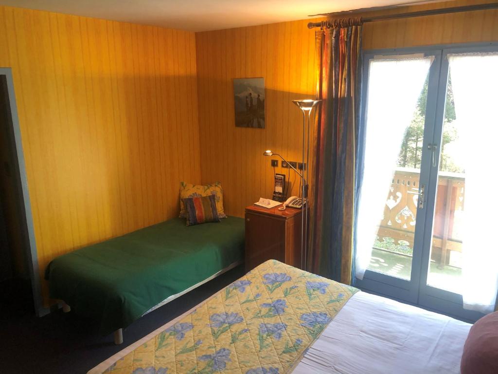Postel nebo postele na pokoji v ubytování Brit Hotel Florimont