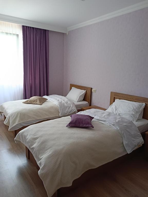 Postel nebo postele na pokoji v ubytování M7 House