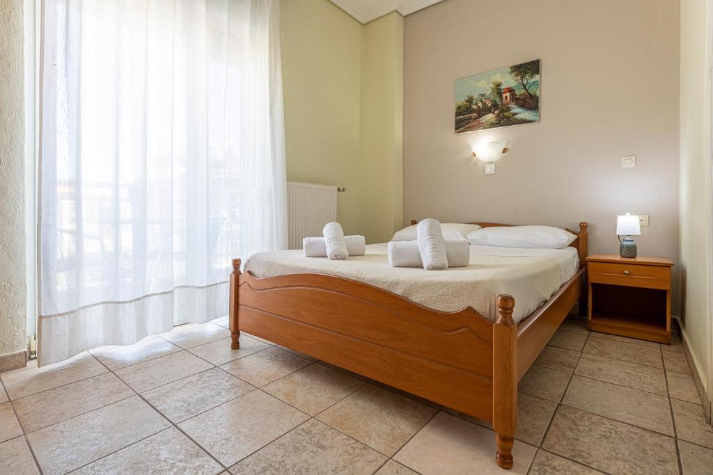 Postel nebo postele na pokoji v ubytování Lucia Hotel Paralia