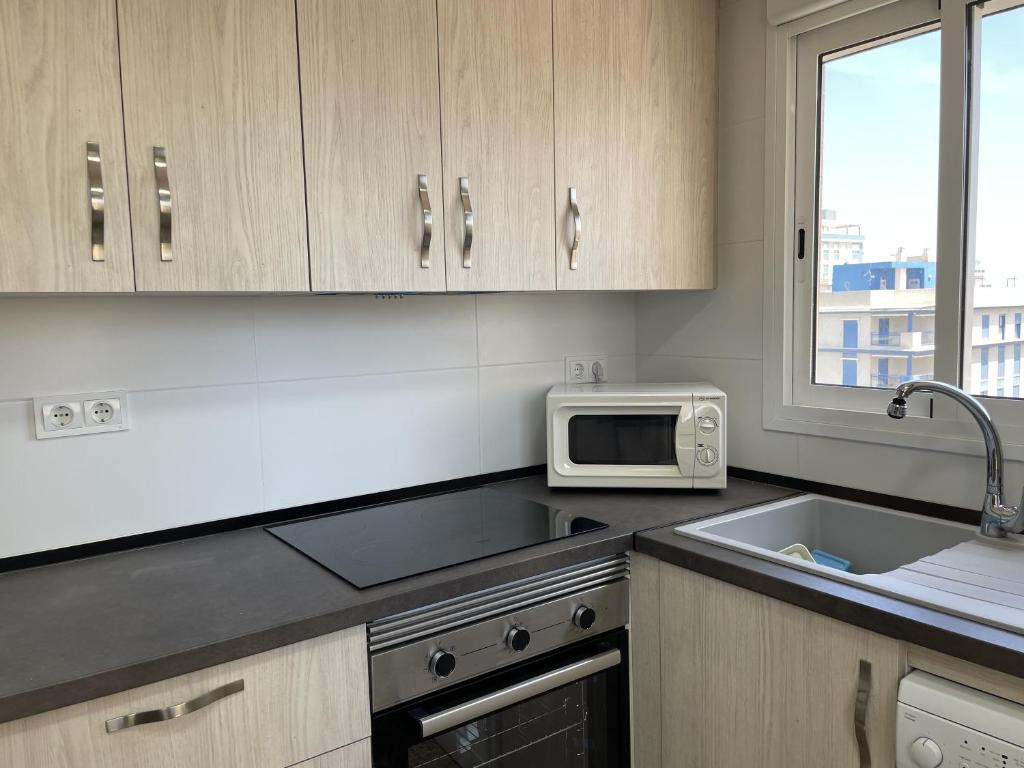 Kuchyň nebo kuchyňský kout v ubytování Apartamento mejor zona de Gandia