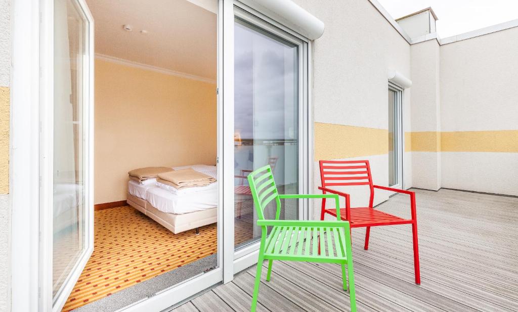 Postel nebo postele na pokoji v ubytování Hotel Friese