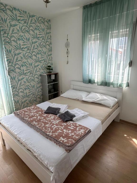 Postel nebo postele na pokoji v ubytování Ana’s 2 bedrooms lovely flat
