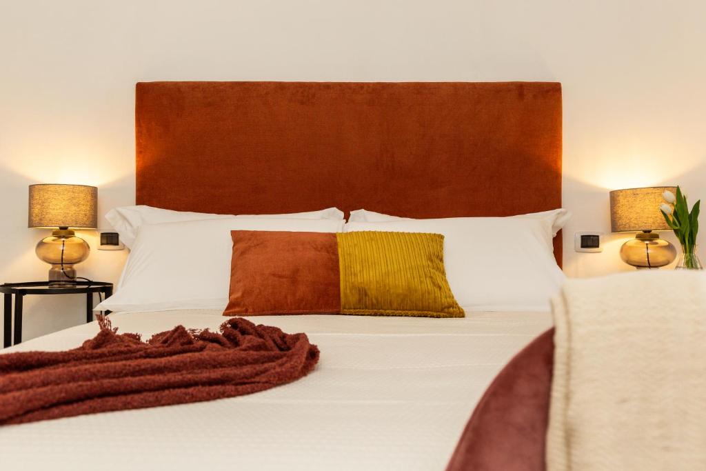 Postel nebo postele na pokoji v ubytování Loft Rooms I Cinque Mori