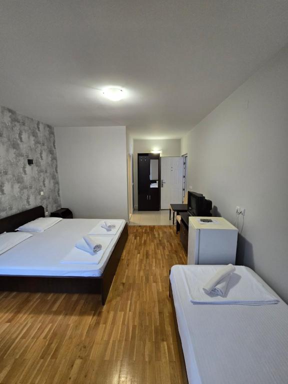 Postel nebo postele na pokoji v ubytování Apartments Philip II